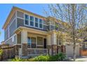 Charming two-story home with a covered porch and attractive stone accents at 1226 S Fulton St, Aurora, CO 80247