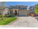 Inviting two-story home featuring a spacious driveway and well-maintained landscaping at 1226 S Fulton St, Aurora, CO 80247