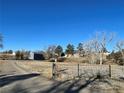 House with a long driveway and a large yard, located on a hilltop at 12505 N 3Rd St, Parker, CO 80134