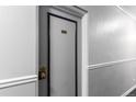 Apartment hallway with gray textured walls and door 204 at 1450 Albion St # 204, Denver, CO 80220