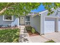Inviting front entrance with well-kept landscaping, walkway and covered porch of this pleasing home at 4071 E 126Th Pl, Thornton, CO 80241