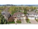 Charming two-story home featuring a well-maintained front yard and a two car garage at 4059 Nevis St, Boulder, CO 80301
