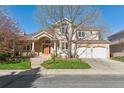 Charming two-story home with a brick facade and a well-maintained front lawn at 4059 Nevis St, Boulder, CO 80301
