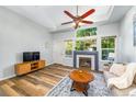 Open living space with fireplace and hardwood floors at 8199 Welby Rd # 4106, Denver, CO 80229