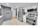 Well-lit kitchen showcasing stainless steel appliances and ample cabinet space at 14300 E Marina Dr # 109, Aurora, CO 80014