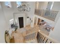 Two-story entry with chandelier and hardwood floors at 5268 Talavero Pl, Parker, CO 80134