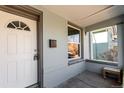 Charming front porch with a white front door and mailbox at 2707 N Lafayette St, Denver, CO 80205