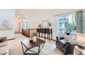 Bright and airy living room featuring high ceilings, natural light, and stylish furniture at 2288 S Depew St, Lakewood, CO 80227
