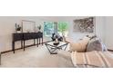 Comfortable living room with large windows, modern decor, and a cozy seating arrangement at 2288 S Depew St, Lakewood, CO 80227