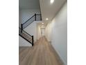 Inviting foyer with hardwood floors and an elegant staircase leading to the upper level at 5626 W 142Nd Ave, Broomfield, CO 80020