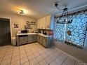 Kitchen with stainless steel appliances and light grey cabinets at 11856 E 7Th Ave, Aurora, CO 80010