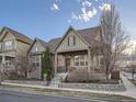 Charming home boasts a covered porch, manicured lawn, and inviting curb appeal with great landscaping at 5590 W 97Th Ave, Westminster, CO 80020