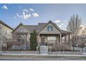 Charming home boasts a covered porch, manicured lawn, and inviting curb appeal with great landscaping at 5590 W 97Th Ave, Westminster, CO 80020