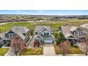Beautiful two-story home with professional landscaping, large driveway, and mountain views at 12996 Banyon Cir, Parker, CO 80134