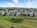 Scenic neighborhood view featuring well-maintained homes and lush greenery with a picturesque horizon at 12996 Banyon Cir, Parker, CO 80134