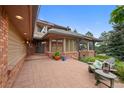 Inviting covered porch with comfortable seating, perfect for enjoying the outdoors in style at 9 Red Fox Ln, Littleton, CO 80127