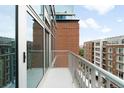 Balcony area with views of the building and city at 1700 Bassett St # 703, Denver, CO 80202