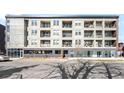 Modern apartment building offers a sleek design, multiple balconies, and convenient urban living at 2851 W 52Nd Ave # 304, Denver, CO 80221