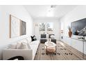 Bright living room features a modern aesthetic, stylish decor, and plenty of natural light at 2851 W 52Nd Ave # 304, Denver, CO 80221