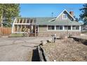 This home boasts a beautiful sunroom, stone accents and a lush front yard at 335 Jefferson St, Monument, CO 80132