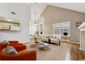 Cozy living room boasts abundant natural light and a seamless open-concept design at 14399 E Grand Dr # 150, Aurora, CO 80015