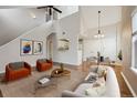 Bright living room with high ceilings, hardwood floors, and stylish furnishings at 14399 E Grand Dr # 150, Aurora, CO 80015