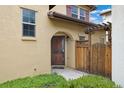 Charming home entrance with a wood gate and decorative security door at 10044 Martin Luther King Blvd, Denver, CO 80238