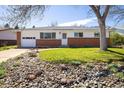 Charming single-story home with a well-kept lawn and rock garden at 1275 Berea Dr, Boulder, CO 80305