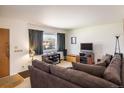 Comfortable living room with a large window and a cozy seating arrangement at 1275 Berea Dr, Boulder, CO 80305