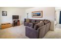 Cozy living room featuring a large sectional sofa and neutral carpet at 1275 Berea Dr, Boulder, CO 80305