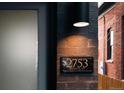 Close-up of the elegant house number plaque, '2753 Curtis St', adding character to the home at 2753 Curtis St, Denver, CO 80205