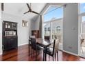 Bright dining area with wood floors, a table for four, and access to a deck at 3335 S Monaco Pkwy # D, Denver, CO 80222
