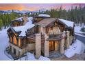 Beautiful stone and wood home featuring an inviting front balcony at 327 Peerless Dr, Breckenridge, CO 80424