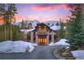 Inviting stone and wood home with a warm and welcoming entryway at 327 Peerless Dr, Breckenridge, CO 80424