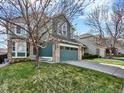 Charming home with a two-car garage and beautiful lawn, perfect for Gathering living at 8380 Blackgum St, Parker, CO 80134
