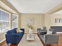 Bright living room features hardwood floors, bay windows, and comfortable seating at 8380 Blackgum St, Parker, CO 80134