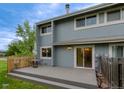 Inviting backyard featuring a spacious patio, a table and chairs, and direct access to the home through sliding glass doors at 4140 Monroe Dr # C, Boulder, CO 80303