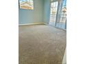 Bedroom showing neutral carpet, sliding glass doors to private deck for relaxing outdoor living at 7440 S Blackhawk St # 207, Englewood, CO 80112