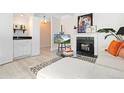 Modern wet bar with white cabinetry and a small sink at 7877 E Mississippi Ave # 604, Denver, CO 80247