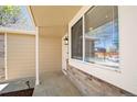Inviting front porch with brick accents and a convenient security system at 4860 E 120Th Pl, Thornton, CO 80241