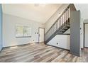 Bright living room with high ceilings, stairs, and modern flooring at 4860 E 120Th Pl, Thornton, CO 80241