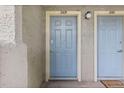 Light blue front door with unit number and door bell located next to another unit door at 20 S Boulder Cir # 2109, Boulder, CO 80303