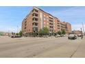 Stylish apartment building featuring brick construction, balconies, and convenient street access at 2229 Blake St # 505, Denver, CO 80205