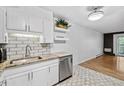 Open concept kitchen with stainless steel appliances, tile floors, and view into the living area at 705 S Alton Way # 6B, Denver, CO 80247