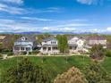 Scenic aerial shot of homes surrounded by lush greenery, creating a serene and desirable community at 9530 Gray St, Westminster, CO 80031