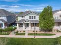 Charming two-story home featuring a welcoming front porch and beautifully landscaped yard, perfect for families at 9530 Gray St, Westminster, CO 80031