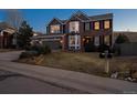 Beautiful two-story home with a three car garage, brick and siding, a front lawn, and a mailbox at 310 S Snowmass Cir, Superior, CO 80027