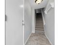 Foyer of home with tile floors and stairs leading to the next level at 12031 E Ford Cir, Aurora, CO 80012