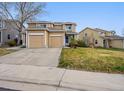 Charming home with a two-car garage, neat lawn and concrete driveway at 7840 Ogden Ct, Denver, CO 80229