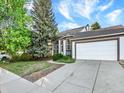 Well-maintained single-Gathering home with a spacious driveway and manicured front yard at 19897 E Brunswick Dr, Aurora, CO 80013